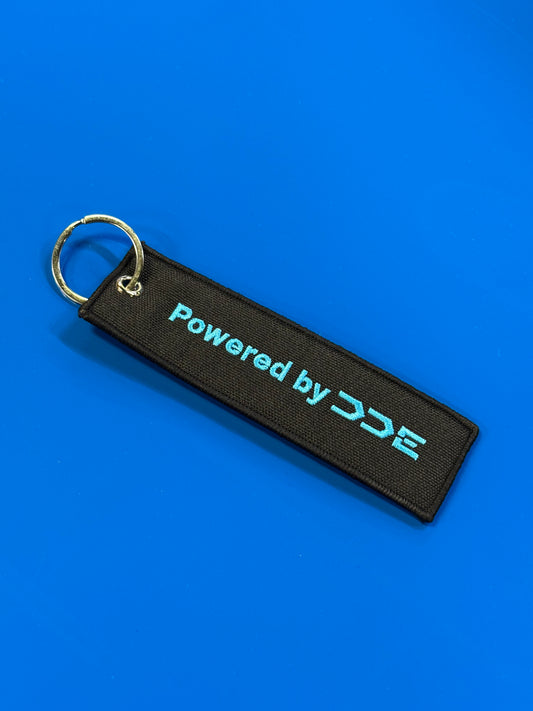 POWERED BY DDE BLACK/BLUE JET TAG